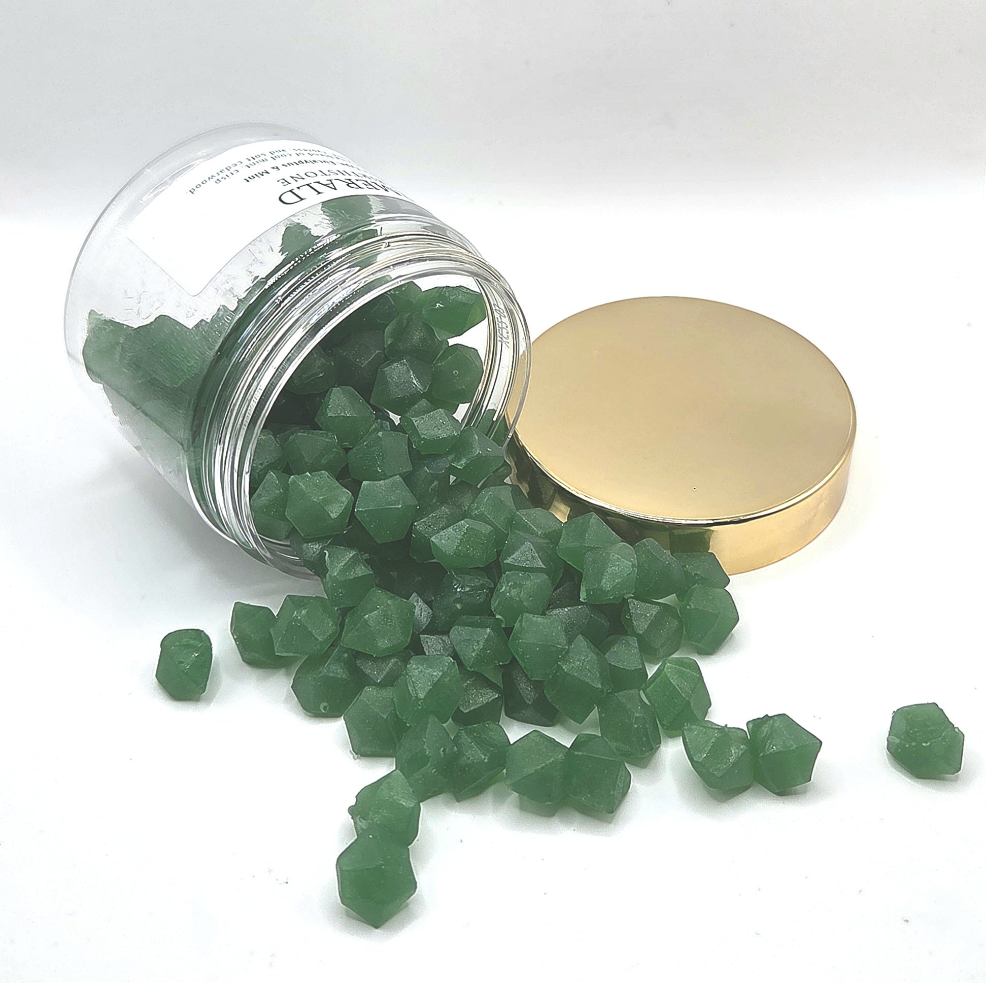 Emerald Wax Melts spilling out of jar
