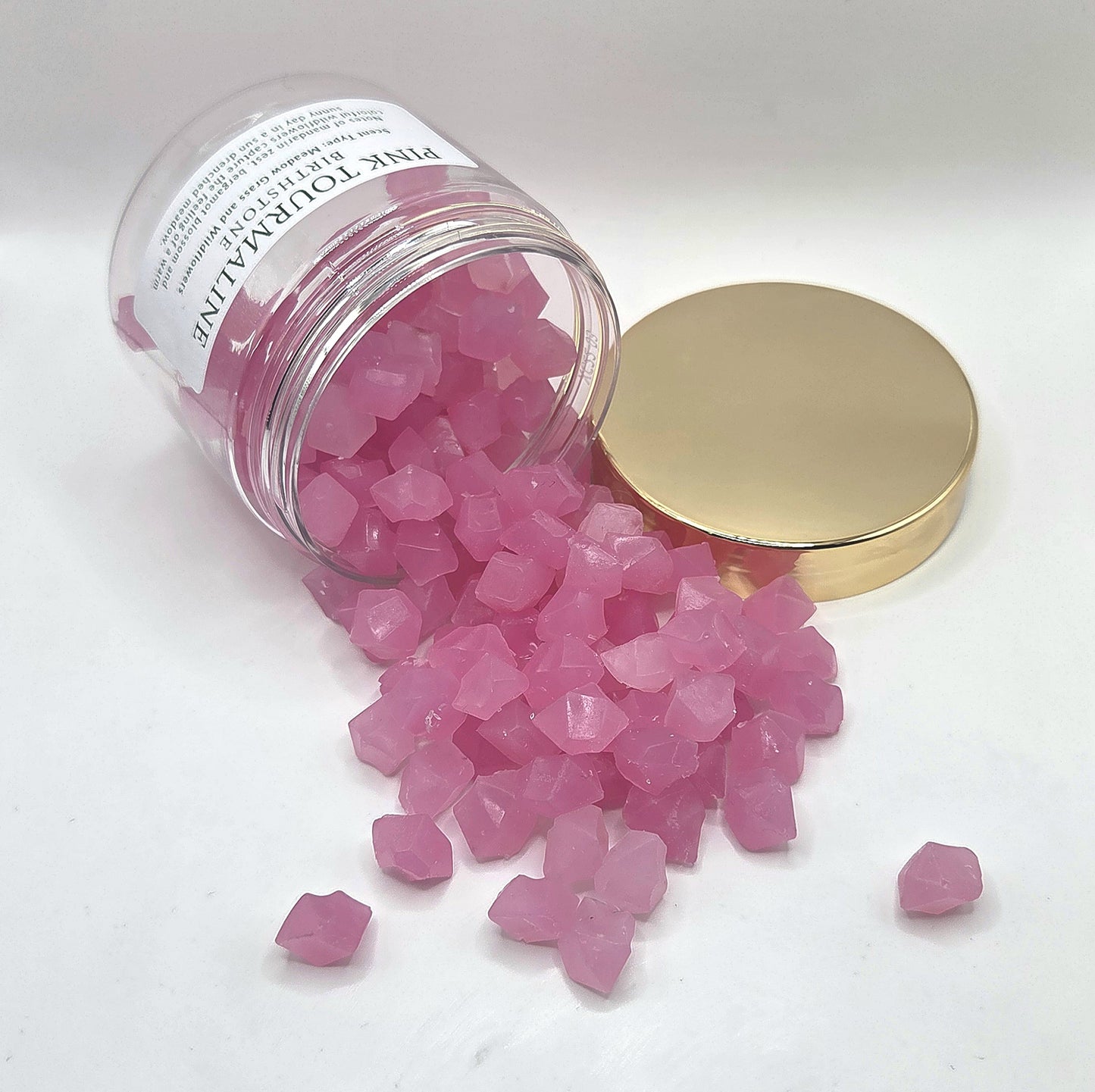 pink tourmaline wax melts spilling from jar